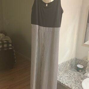Sleeveless Black Top with Black-and-White Striped Wide-Leg Jumpsuit